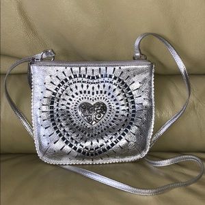 Brighton silver cross body bag with heart.